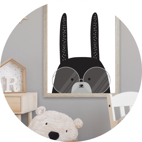 A bunny illustrated print hanging up in a babies room in New Zealand