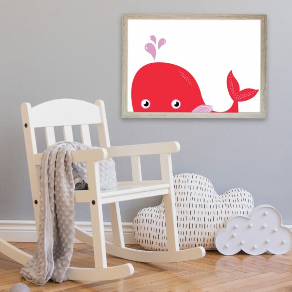 A cute pink whale illustration for children printed and framed as a nursery decoration