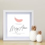 A custom name memorial print with an illustrated angel feather from Blackbird Design Shop